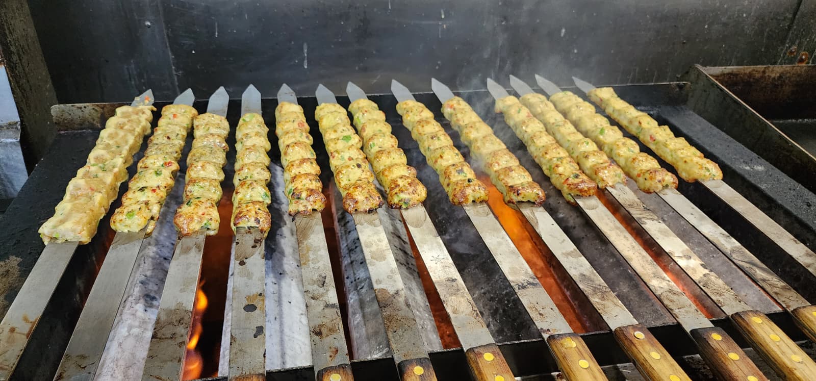 Grilling over open fire at Smokin' Grill
